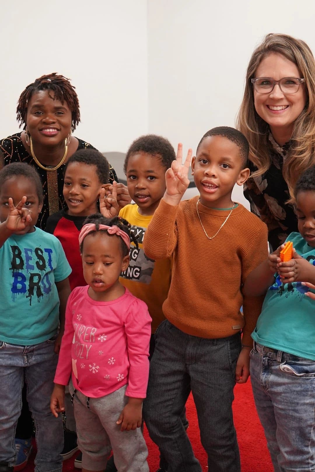Children with teachers at The Beloved Assembly